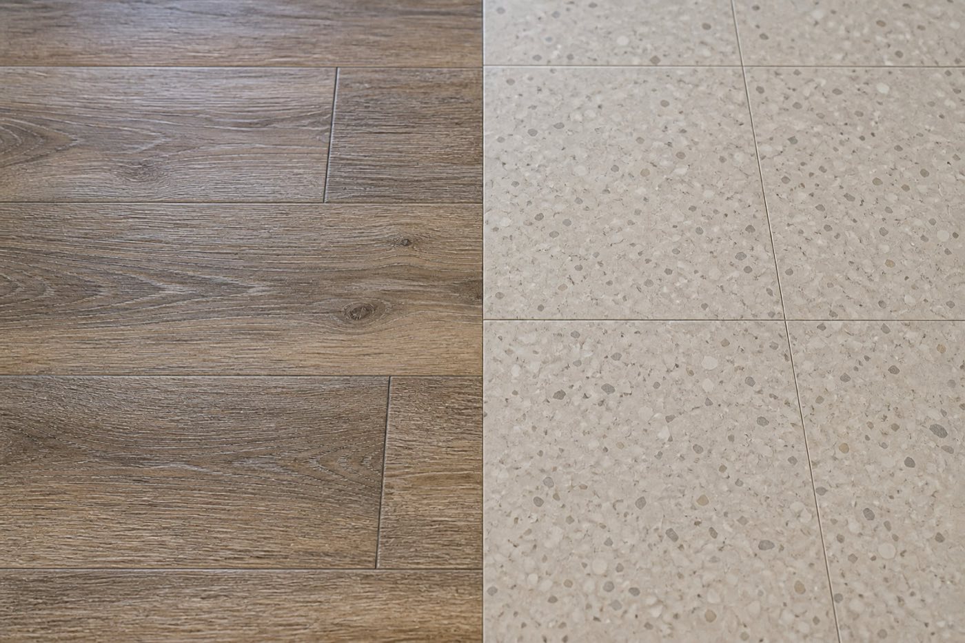 Close-up comparison of wood-look luxury vinyl plank and speckled square VCT flooring